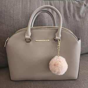 Anne Klein Elegant Taupe Handbag with Pom Pom Charm